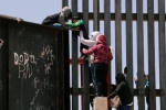 entering US via mexico, punjabis crossing US mexico border, video clip shows punjabi women children crossing border fence into u s, Punjabis